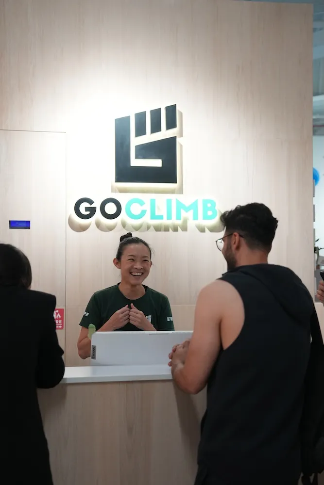 A climber laughing during their first session.