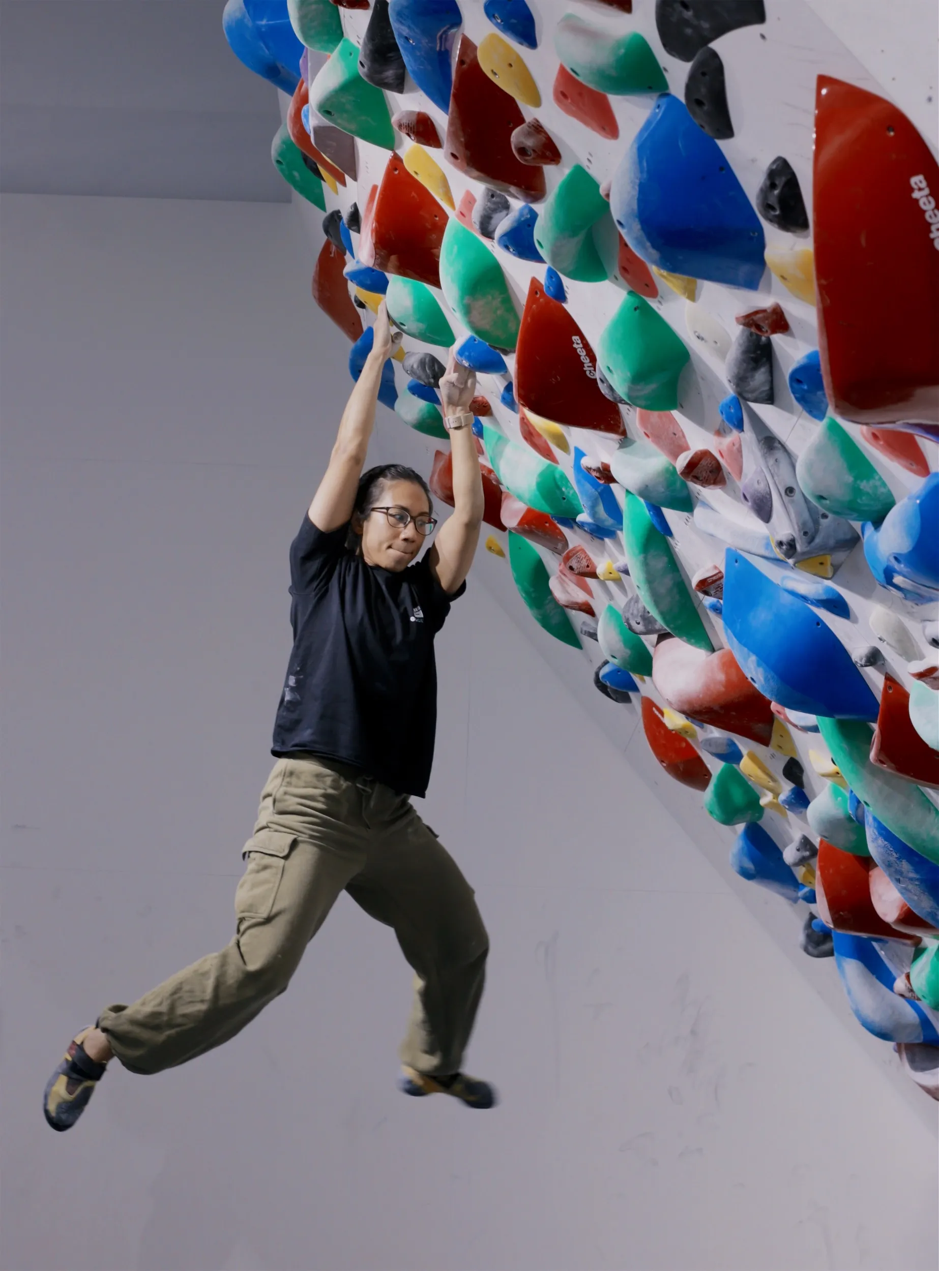 Climber on the spray wall during Sprayground competition at GoClimb