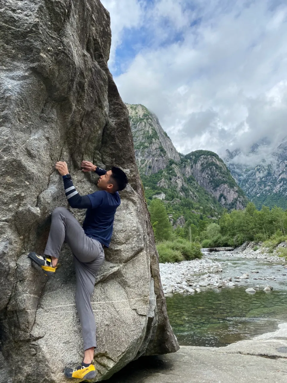 Warming up on a riverside boulder in Val Di Mello