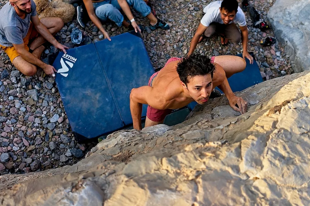Brian cruising up a 6B boulder problem