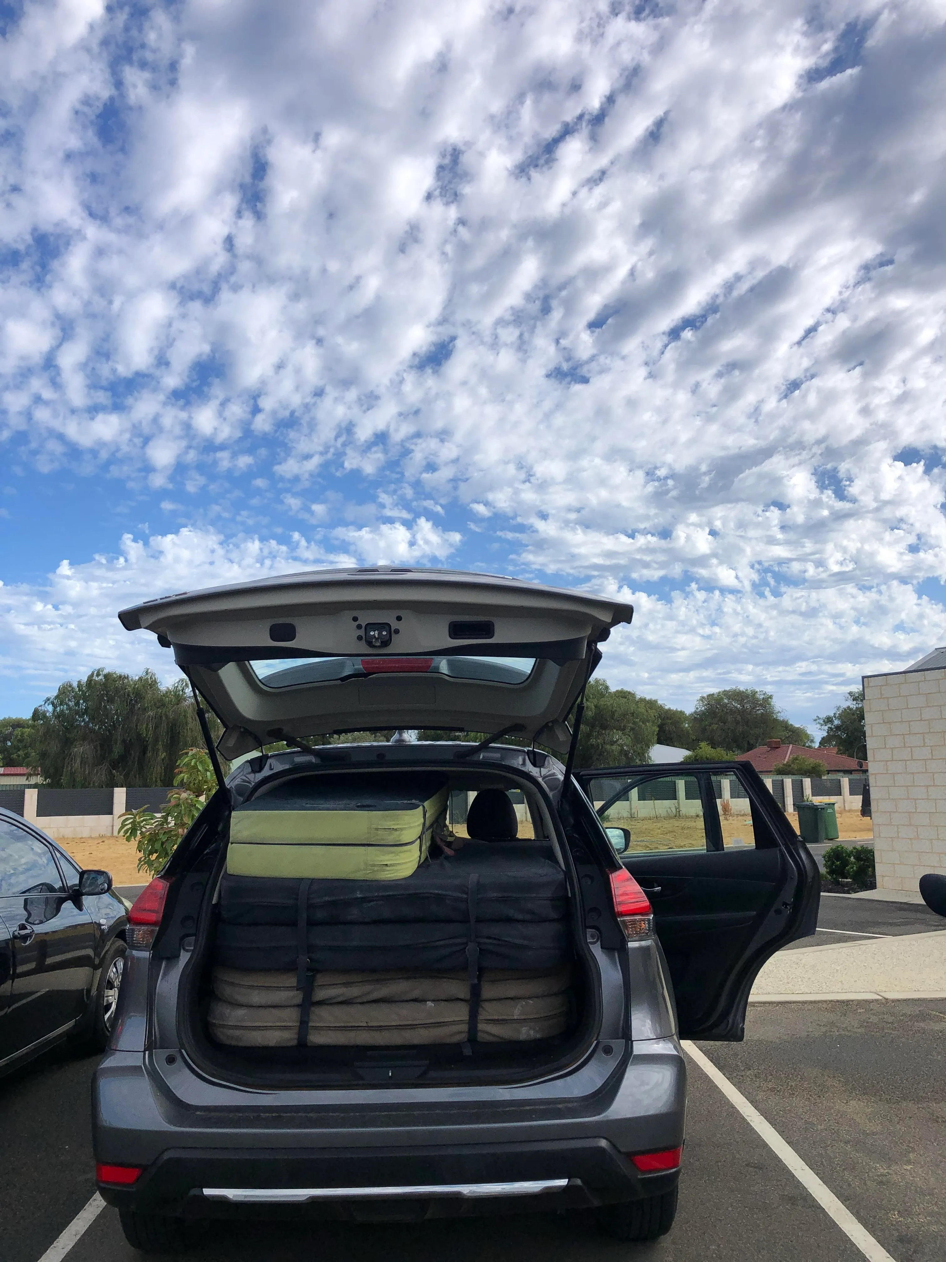 A tight fit for 4 boulder crash pads and 4 people in a Nissan X-Trail